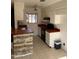 Functional kitchen with white cabinetry and neutral tile flooring for easy upkeep at 4820 N 89Th Ave # 45, Phoenix, AZ 85037