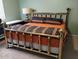 Cozy bedroom featuring a brass bed frame and warm lighting at 1172 S 229Th Dr, Buckeye, AZ 85326