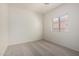 Bedroom with neutral walls, carpet, and window at 1384 E Press Rd, San Tan Valley, AZ 85140