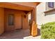 Close-up of the front door entrance showing the exterior home materials, landscaping and lighting at 1384 E Press Rd, San Tan Valley, AZ 85140