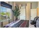 Bedroom with modern color scheme and large window at 18001 W Cassia Way, Goodyear, AZ 85338