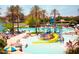 The active community pool has a water slide, various play features, and lots of seating at 18001 W Cassia Way, Goodyear, AZ 85338