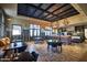 Stylish dining and kitchen area features modern appliances, beautiful flooring, and cozy seating, perfect for entertaining guests at 18001 W Cassia Way, Goodyear, AZ 85338