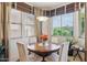 Inviting breakfast nook and dining area, featuring large windows and neutral paint at 18001 W Cassia Way, Goodyear, AZ 85338