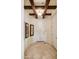 Inviting foyer featuring travertine floors, decorative lighting, and views into the home's living spaces at 18001 W Cassia Way, Goodyear, AZ 85338