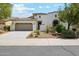 Charming single-Gathering home with a well-manicured lawn and a two-car garage in a suburban neighborhood at 18001 W Cassia Way, Goodyear, AZ 85338