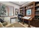 Inviting home office with custom built-ins and a large window at 18001 W Cassia Way, Goodyear, AZ 85338