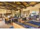 Open-concept living room boasts high ceilings, elegant furnishings, and abundant natural light, creating a welcoming atmosphere at 18001 W Cassia Way, Goodyear, AZ 85338