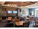Elegant resident lounge features comfortable seating, televisions, bookshelves, and a pool table at 18001 W Cassia Way, Goodyear, AZ 85338