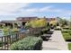 Inviting poolside view with manicured landscaping, elegant clubhouse, and tranquil ambiance, ideal for relaxation and community enjoyment at 18001 W Cassia Way, Goodyear, AZ 85338