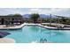 Resort-style pool with mountain views, lounge seating, and ample space, perfect for leisure and recreation in a serene environment at 18001 W Cassia Way, Goodyear, AZ 85338