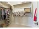 Well-organized walk-in closet with shelving, hanging space, and ample storage solutions at 18001 W Cassia Way, Goodyear, AZ 85338