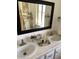 Bright bathroom featuring double sinks, a large mirror, and ample counter space at 1833 E Bluefield Ave, Phoenix, AZ 85022
