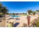Large community pool surrounded by lounge chairs and umbrellas, perfect for relaxation at 23145 E Via Las Brisas --, Queen Creek, AZ 85142