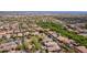 This sprawling aerial showcases a meticulously planned community with elegant homes and lush landscaping nestled in an established neighborhood at 2305 N Heritage St, Buckeye, AZ 85396