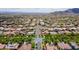 Expansive aerial view showcasing a meticulously planned community with tree-lined streets, elegant homes, and manicured landscaping at 2305 N Heritage St, Buckeye, AZ 85396