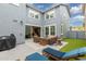 Backyard featuring a patio with seating, a barbecue, and an artificial lawn, perfect for outdoor living at 2305 N Heritage St, Buckeye, AZ 85396