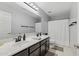 Bathroom featuring double sinks, a large mirror and modern fixtures at 2305 N Heritage St, Buckeye, AZ 85396