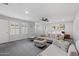 Bedroom with a seating area, plantation shutters, and neutral decor at 2305 N Heritage St, Buckeye, AZ 85396