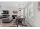 Bright dining area with large windows and modern furnishings, perfect for Gathering meals and gatherings at 2305 N Heritage St, Buckeye, AZ 85396