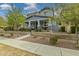 Charming two-story home with a welcoming front porch and well-maintained landscaping in a residential neighborhood at 2305 N Heritage St, Buckeye, AZ 85396