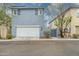 Charming two-story home with a white garage door and well-maintained landscaping at 2305 N Heritage St, Buckeye, AZ 85396