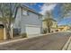 Charming two-story home with a white garage door and well-maintained landscaping at 2305 N Heritage St, Buckeye, AZ 85396