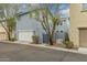 Charming two-story home with a white garage door and well-maintained landscaping at 2305 N Heritage St, Buckeye, AZ 85396