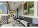 Cozy front porch with comfortable seating, perfect for relaxing outdoors with a view of the neighborhood at 2305 N Heritage St, Buckeye, AZ 85396