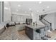 Kitchen with granite counters, stainless steel appliances, gray cabinets, and a center island at 2305 N Heritage St, Buckeye, AZ 85396