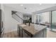 Kitchen island featuring granite countertops, a stainless steel dishwasher, and a sink at 2305 N Heritage St, Buckeye, AZ 85396