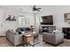 Comfortable living room with a large sectional sofa, modern furniture, and a large window at 2305 N Heritage St, Buckeye, AZ 85396