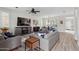 Spacious living room with modern furnishings, a cozy fireplace, and ample natural light for comfortable living at 2305 N Heritage St, Buckeye, AZ 85396