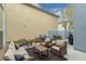 Outdoor patio with comfortable seating, a grill, and an artificial lawn, ideal for entertaining guests at 2305 N Heritage St, Buckeye, AZ 85396