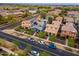 Charming neighborhood street view with colorful homes, manicured landscaping, and solar panels on many rooftops at 2305 N Heritage St, Buckeye, AZ 85396