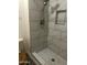 Modern shower featuring marble tile and a built-in niche for storage at 2315 W Union Hills Dr # 120, Phoenix, AZ 85027