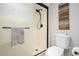 Modern bathroom with a glass-enclosed shower, toilet, and towel rack at 4303 E Cactus Rd # 407, Phoenix, AZ 85032