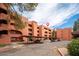 Apartment complex with ample parking, mature landscaping, and well-maintained exteriors in a residential area at 4303 E Cactus Rd # 407, Phoenix, AZ 85032
