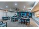 Community room featuring multiple seating arrangements, ceiling fans, and large windows for natural light at 4303 E Cactus Rd # 407, Phoenix, AZ 85032