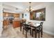 Well-lit dining room features a chandelier and large windows with an outside view at 4303 E Cactus Rd # 407, Phoenix, AZ 85032