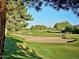 Scenic view of the golf course, showcasing lush greens, trees, and a sand trap at 4303 E Cactus Rd # 407, Phoenix, AZ 85032
