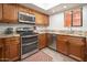 Fully equipped kitchen features modern appliances, granite countertops, and ample cabinet space at 4303 E Cactus Rd # 407, Phoenix, AZ 85032