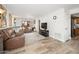 Spacious living room with a comfortable sectional sofa, ceiling fan, and access to the kitchen at 4303 E Cactus Rd # 407, Phoenix, AZ 85032