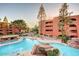 Exterior shot of the community pool and surrounding buildings in a residential neighborhood at 4303 E Cactus Rd # 407, Phoenix, AZ 85032
