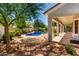 Relaxing backyard with covered patio and a view of the private pool at 5752 S Crossbow Pl, Chandler, AZ 85249