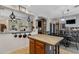 Charming kitchen featuring an island, dark wood dining set and breakfast bar overlooking dining area at 88 W Reeves Ave, San Tan Valley, AZ 85140