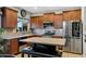 Well-equipped kitchen with stainless steel appliances, center island, and ample cabinet space at 88 W Reeves Ave, San Tan Valley, AZ 85140
