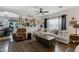 Bright living room with hardwood floors, comfortable white sofa, and decorative accents at 88 W Reeves Ave, San Tan Valley, AZ 85140