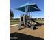 Community playground with slide and climbing structure, offering children a fun outdoor recreation area at 1370 W Siboney St, San Tan Valley, AZ 85143