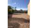 A view of the potential of the backyard space, ideal for landscaping and relaxation, creating a serene outdoor experience at 23236 W Yavapai St, Buckeye, AZ 85326